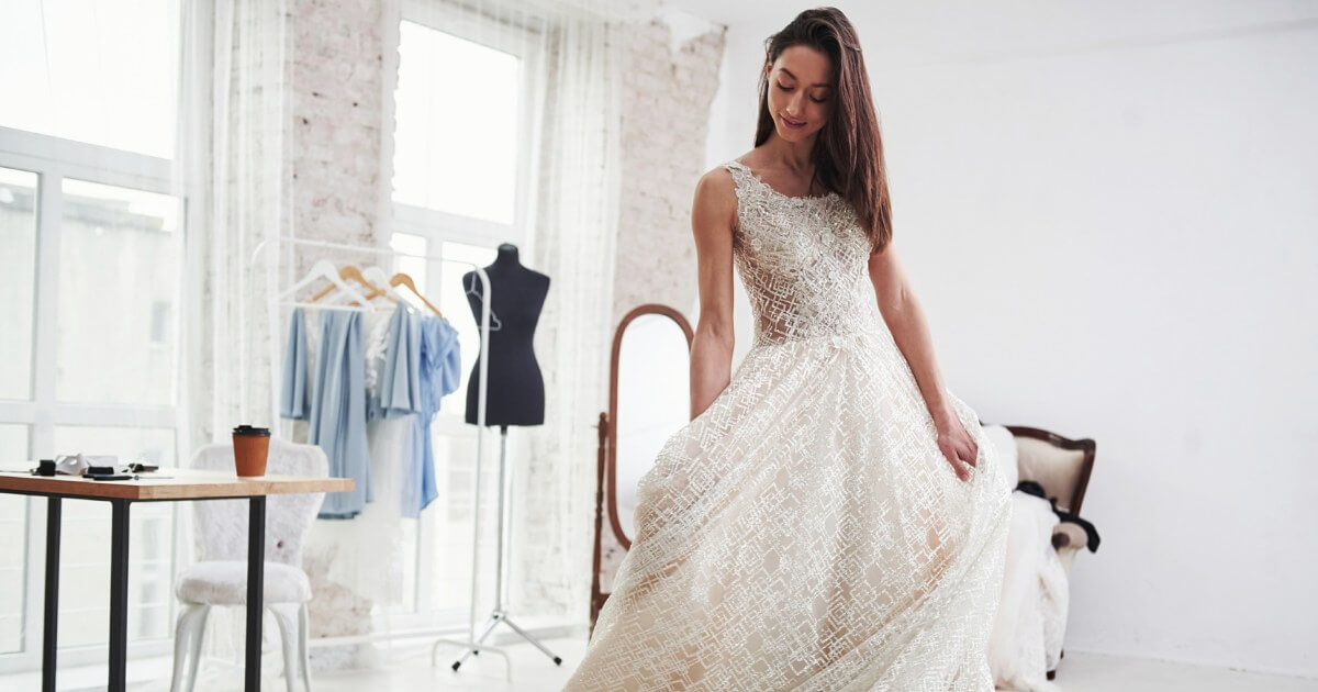 An beautiful, slim woman in a wedding dress.