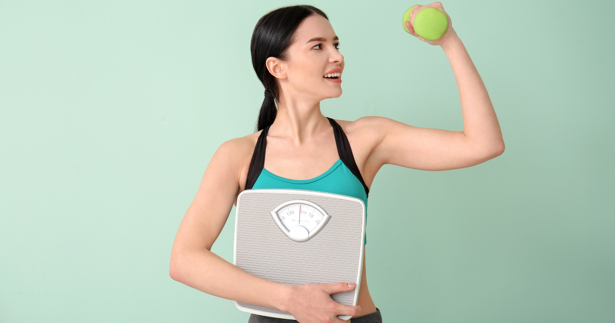 A woman lifting weight and holding a scale